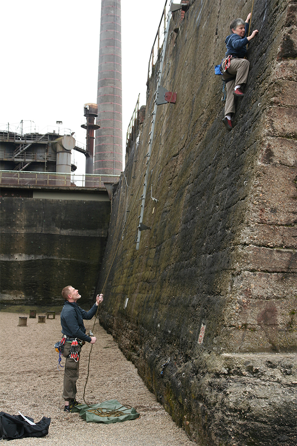 Person climbing wall