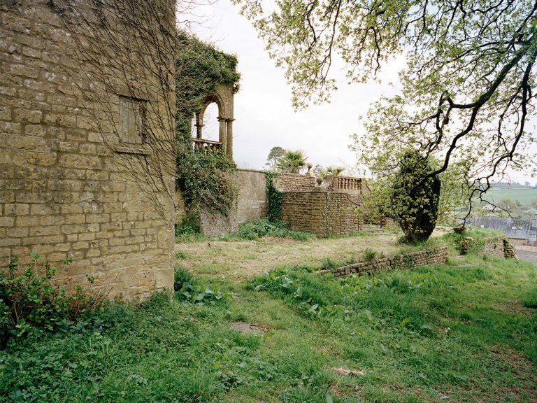 Photo of a family home in the South-west, a crafted Victorian stone structure in a rolling parkland landscape