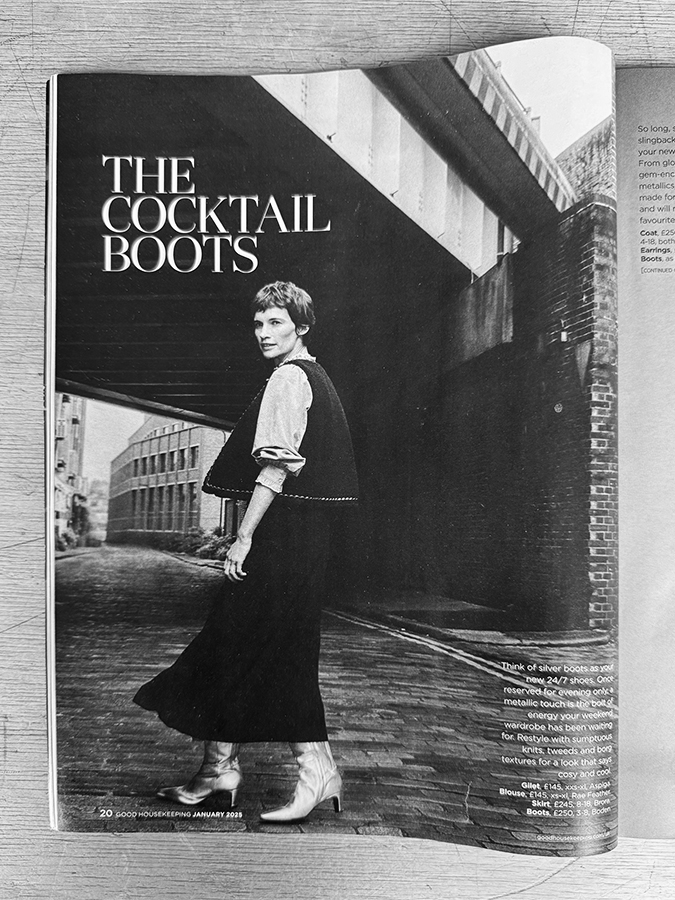 Photo of magazine cover with model under bridge with the text "The Cocktail Boots"