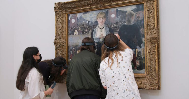 People exploring fine details of art at The Courtauld Institute of Art