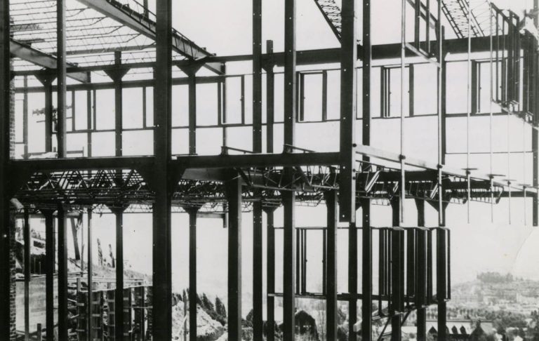 Black and white photo of skeletal structure of building