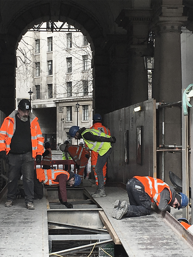 Diligent last-minute checks before pouring concrete into the new basement vault formwork.