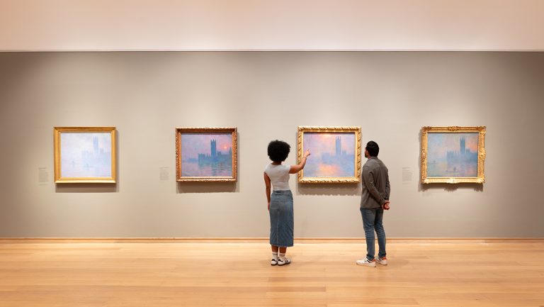 Observers admire Monet paintings