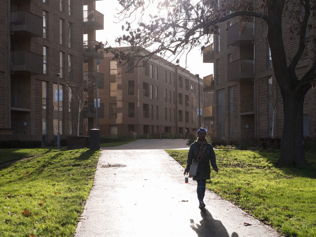 Resident walks through Catford Green estate